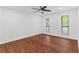 This large bedroom features wood floors, ceiling fan, and two windows for ample natural light at 1301 Cumberland Se Ct, Smyrna, GA 30080