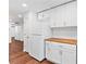 Kitchen featuring wood-look floors, white cabinets and butcher block countertops at 1301 Cumberland Se Ct, Smyrna, GA 30080