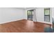 Open living room with wood floors, fireplace, and sliding door to balcony at 1301 Cumberland Se Ct, Smyrna, GA 30080