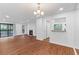 Large living area with hardwood floors, fireplace, and access to the balcony at 1301 Cumberland Se Ct, Smyrna, GA 30080