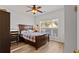 Cozy bedroom with hardwood floors, a window providing natural light, and neutral décor at 2319 Alnwick Dr, Duluth, GA 30096