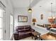 Cozy sitting area with wood floors, seamlessly connected to the dining space, creating a warm and inviting atmosphere at 2319 Alnwick Dr, Duluth, GA 30096