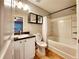 Bathroom with tub and shower, white vanity, and tiled flooring at 2430 Piering Dr, Lithonia, GA 30038