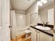 Well-maintained bathroom features shower-tub combo and vanity sink with mirror at 2430 Piering Dr, Lithonia, GA 30038