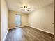 Bedroom with great natural light featuring laminate floors and ceiling fan at 2430 Piering Dr, Lithonia, GA 30038
