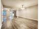Spacious living room area featuring laminate flooring, neutral walls and natural light at 2430 Piering Dr, Lithonia, GA 30038
