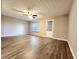 Living room featuring laminate flooring, neutral walls, natural light, and a ceiling fan at 2430 Piering Dr, Lithonia, GA 30038