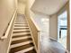 Staircase with hardwood floors and white railings at 2430 Piering Dr, Lithonia, GA 30038