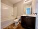 Bathroom with a white vanity and a tub/shower combo with white tile at 2526 Piering Dr, Lithonia, GA 30038