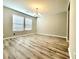 Dining room with chandelier, bright windows, and hard surface floors at 2526 Piering Dr, Lithonia, GA 30038