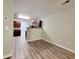 Open-concept dining area with laminate flooring, seamlessly connecting to the kitchen at 2526 Piering Dr, Lithonia, GA 30038