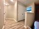 Hallway features wood-look flooring, white trim, and two large closets for plenty of storage at 2526 Piering Dr, Lithonia, GA 30038