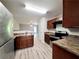 Efficient kitchen featuring modern stainless steel appliances and wood grain cabinets at 2526 Piering Dr, Lithonia, GA 30038