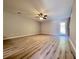 Large living room featuring hard surface floors, a ceiling fan, and a back door to the outdoors at 2526 Piering Dr, Lithonia, GA 30038