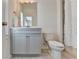 Updated bathroom featuring a gray vanity with marble countertop and tile flooring at 3910 Cameron Ct, Cumming, GA 30040
