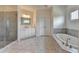 Spacious bathroom with a glass-enclosed shower, soaking tub, and double vanity at 3910 Cameron Ct, Cumming, GA 30040