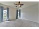 Spacious bedroom featuring plush carpeting and bright, filtered sunlight at 3910 Cameron Ct, Cumming, GA 30040