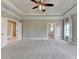 Expansive bedroom featuring tray ceiling, neutral tones, and natural light at 3910 Cameron Ct, Cumming, GA 30040