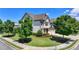 A lush front lawn and professional landscaping complement this two-story home's exterior at 3910 Cameron Ct, Cumming, GA 30040