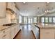 Spacious kitchen featuring granite countertops, stainless steel appliances, and ample cabinet space at 3910 Cameron Ct, Cumming, GA 30040