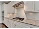 Close up of the kitchen featuring stainless steel appliances, granite countertops, and a gas cooktop at 3910 Cameron Ct, Cumming, GA 30040