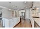Modern kitchen featuring an island with sink, stainless steel appliances, and white cabinets at 3910 Cameron Ct, Cumming, GA 30040