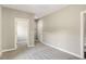Neutral bedroom with carpet, neutral paint, baseboard trim, and a view into the walk-in closet at 472 Martin Se St # 10, Atlanta, GA 30312