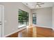 Bedroom with polished wood floors and large windows overlooking greenery at 472 Martin Se St # 10, Atlanta, GA 30312