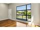 Bedroom with wood floors and large windows overlooking the city at 472 Martin Se St # 10, Atlanta, GA 30312