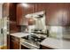 Updated kitchen with stainless steel appliances, sleek countertops, and rich wood cabinetry at 472 Martin Se St # 10, Atlanta, GA 30312
