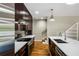 Modern kitchen featuring stainless steel appliances, sleek countertops, and dark wood cabinetry at 472 Martin Se St # 10, Atlanta, GA 30312