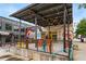 Al fresco seating area provides a trendy outdoor dining experience with modern design and string lights at 472 Martin Se St # 10, Atlanta, GA 30312