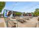 Spacious outdoor seating area with picnic tables and overhead string lights, perfect for gatherings at 472 Martin Se St # 10, Atlanta, GA 30312