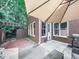 Charming backyard with patio area, lush landscaping, and brick accents, perfect for outdoor entertaining at 5605 Waters Edge Trl, Roswell, GA 30075