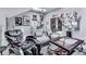 Open concept bonus room with skylights, a massage chair, comfortable seating, and personalized wall decor at 5605 Waters Edge Trl, Roswell, GA 30075