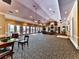 Spacious clubhouse area for residents, featuring comfortable seating, a fireplace, and ample lighting at 5605 Waters Edge Trl, Roswell, GA 30075