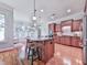 Spacious kitchen with island, stainless steel appliances, and hardwood floors at 5605 Waters Edge Trl, Roswell, GA 30075