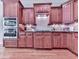 Gourmet kitchen with stainless steel appliances, custom cabinets, and granite countertops at 5605 Waters Edge Trl, Roswell, GA 30075