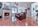 Spacious living room with fireplace, hardwood floors, and ample seating at 5605 Waters Edge Trl, Roswell, GA 30075