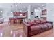 Living room featuring hardwood floors, a fireplace, and a view into the kitchen at 5605 Waters Edge Trl, Roswell, GA 30075