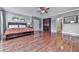 Large main bedroom featuring hardwood floors and a cozy seating area at 5605 Waters Edge Trl, Roswell, GA 30075