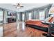 Spacious main bedroom with hardwood floors, tray ceiling, and large windows at 5605 Waters Edge Trl, Roswell, GA 30075