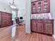 Comfortable office features stylish furnishings and beautiful built-in storage for a productive workspace at 5605 Waters Edge Trl, Roswell, GA 30075