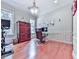 Bright home office featuring ample natural light, hardwood floors, and elegant furnishings at 5605 Waters Edge Trl, Roswell, GA 30075