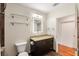 The light and bright bathroom includes a granite-topped vanity and a shower-tub combo with modern lighting at 1080 Peachtree Ne St # 608, Atlanta, GA 30309