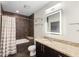 Modern bathroom with a bathtub, shower, granite countertop, and LED lighted mirror at 1080 Peachtree Ne St # 608, Atlanta, GA 30309