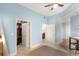 Bright bedroom featuring a ceiling fan, a walk-in closet, ensuite bathroom and a modern decor at 1080 Peachtree Ne St # 608, Atlanta, GA 30309