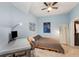 Comfortable bedroom with a stylish ceiling fan, desk, and modern decor, creating a welcoming atmosphere at 1080 Peachtree Ne St # 608, Atlanta, GA 30309