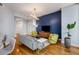 Cozy living room featuring hardwood floors, comfortable seating, and a modern lighting fixture at 1080 Peachtree Ne St # 608, Atlanta, GA 30309
