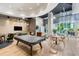 Spacious lounge area featuring a pool table, modern furniture, and large windows with natural light at 1080 Peachtree Ne St # 608, Atlanta, GA 30309
